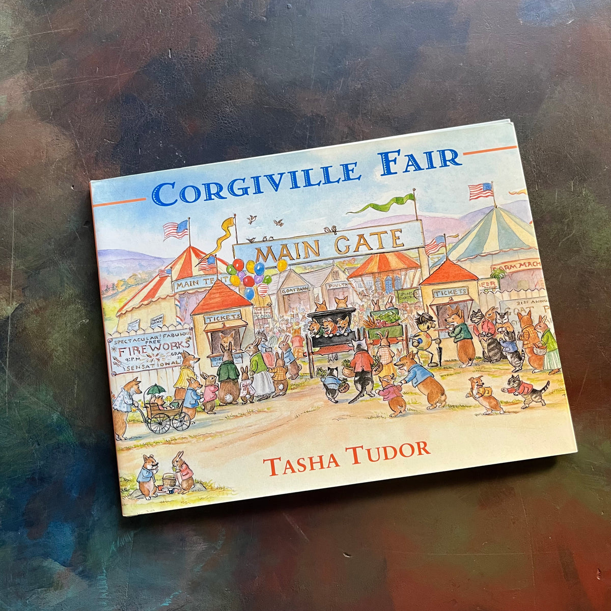 Corgiville Fair written and illustrated by Tasha Tudor-1971 First Edition-classic children's picture book-collector's edition-corgi dogs-view of the dust jacket's front cover depicting the Main Gate of the Gorgiville Fair