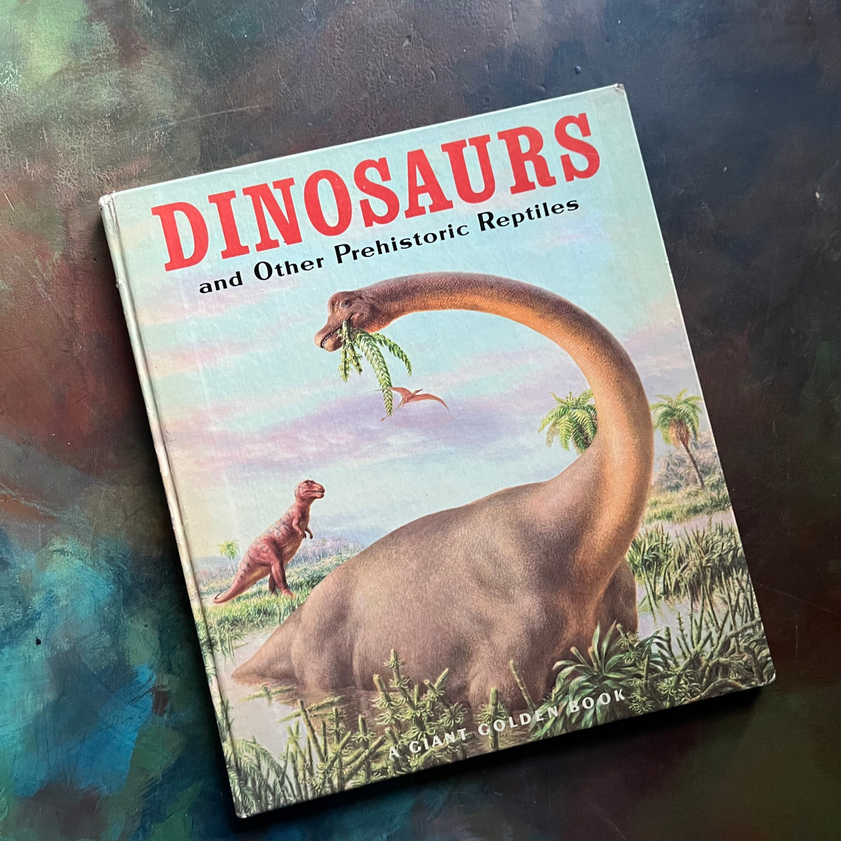 Dinosaurs and Other Prehistoric Reptiles written by Jane Werner Watson with illustrations by Rudolph F. Zallinger-A Giant Golden Book-1960's children's picture book-living science book for children-view of the front cover