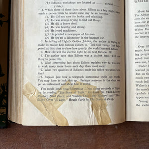 Elson--Gray Basic Readers Vintage School Book Set of 4 Books-view of the condition of the books - closeup of old scotch tape used to repair a tear at the bottom of a page