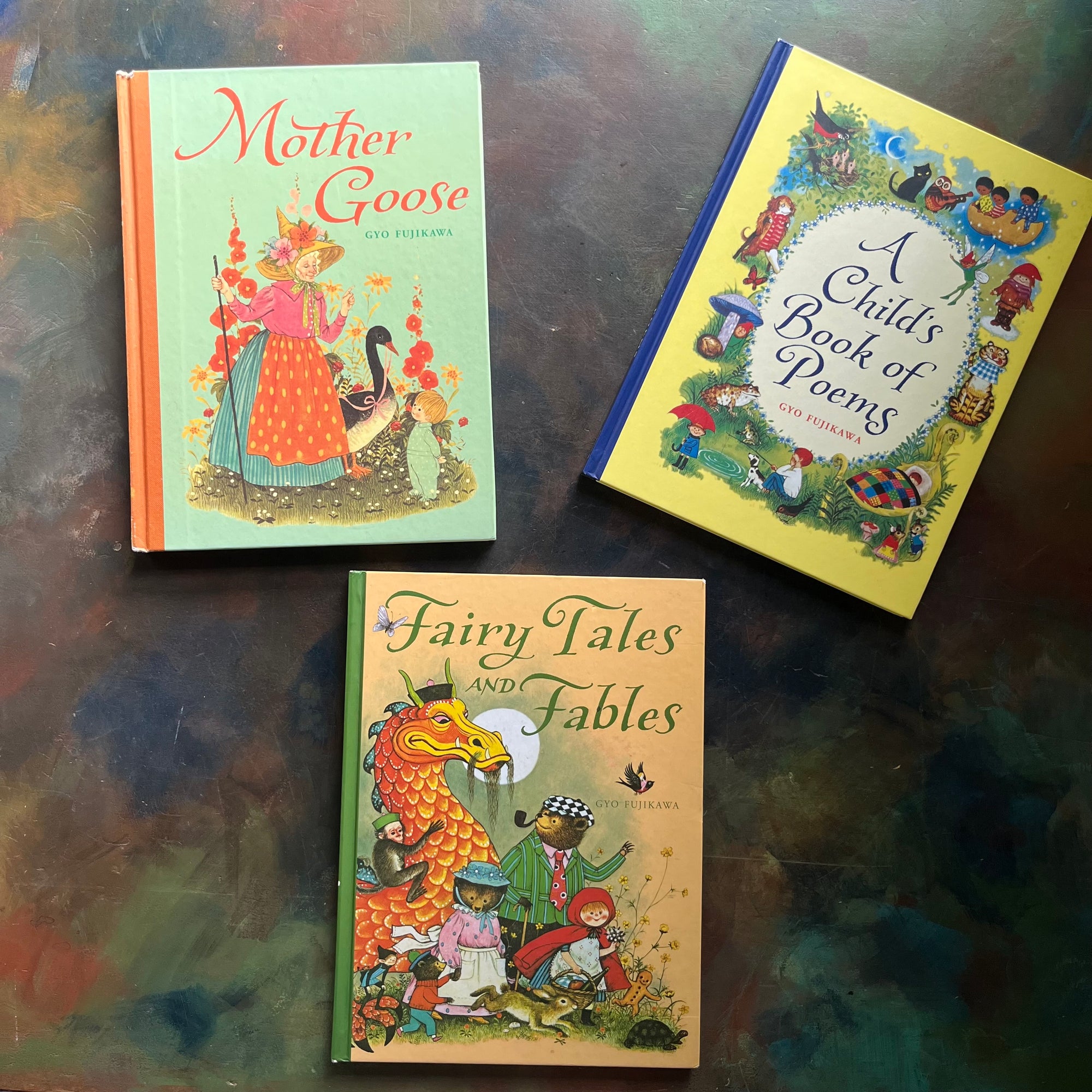 Set of Three children's books illustrated by Gyo Fukikawa-Fairy Tales and Fables-Mother Goose-a child's book of poems-Gyo Fujikawa-vintage children's stories-view of the glossy front covers