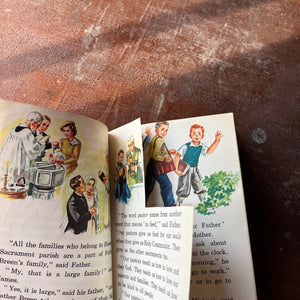 vintage Catholic School textbooks for elementary school - Pair of Faith & Freedom Books by Ginn and Company:  This is Our Parish & These Are Our Neighbors - view of a small section of a page which has been cut out - it was an image - no words are missing so the book can still be read