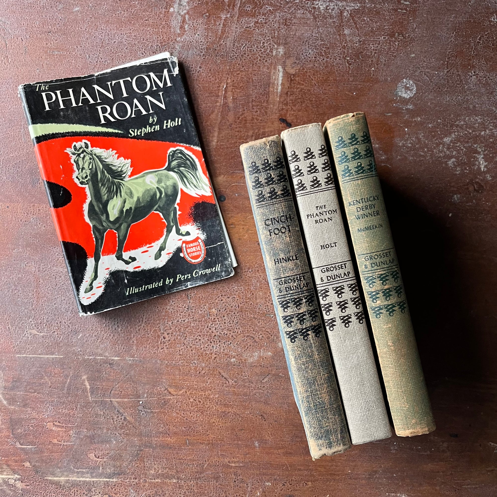 Famous Horse Stories-The Phantom Roan, Chinchfoot & Kentucky Derby Winner-vintage children's chapter books-view of the spines featuring the same design on each one with the book title, author's last name & publisher listed in the middle of each spine