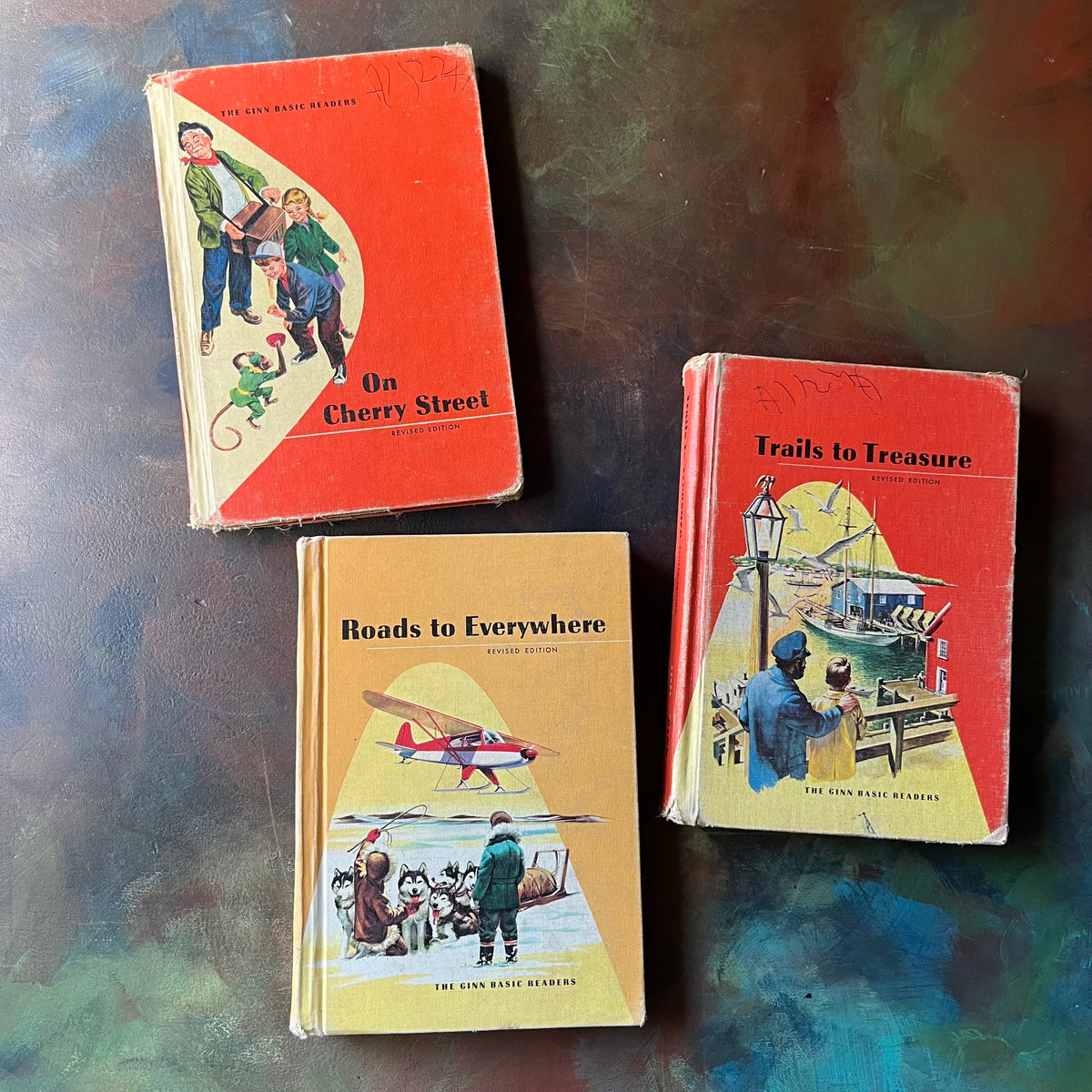 Ginn Basic Readers Vintage School Book Set-On Cherry Street-Roads Everywhere-Trails to Treasure-vintage reading comprehension books-vintage schoolbooks-view of the front covers