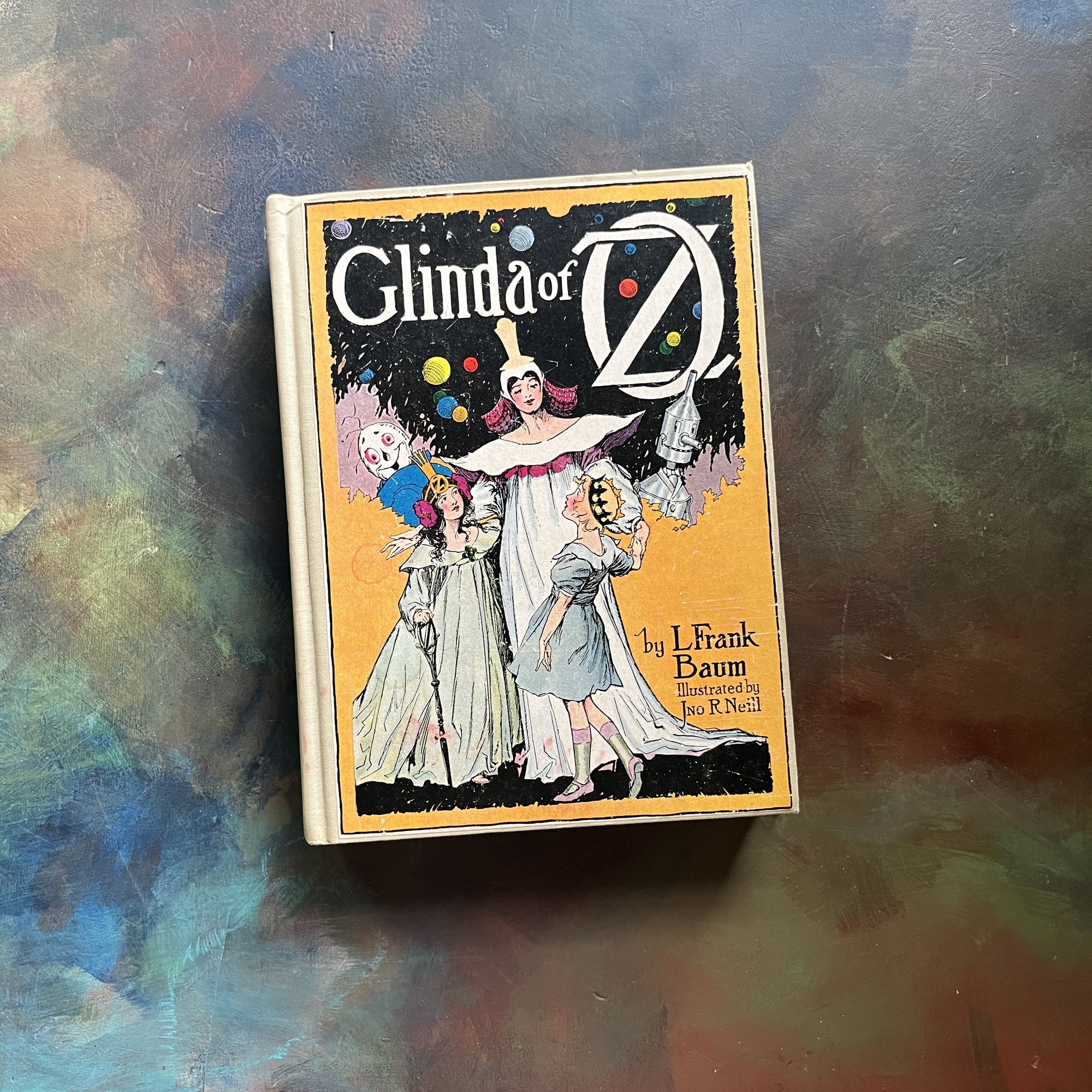 Glinda of Oz - a hardcover antique children's book written by L. Frank Baum with illustrations by John R. Neill - view of the front cover with an illustration of Glinda