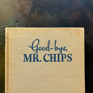 Good-Bye Mr. Chips written by James Hilton-Classic British Literature-vintage novella-heartwarming, wholesome story-closeup view of the foxing noted at the top of the book cover