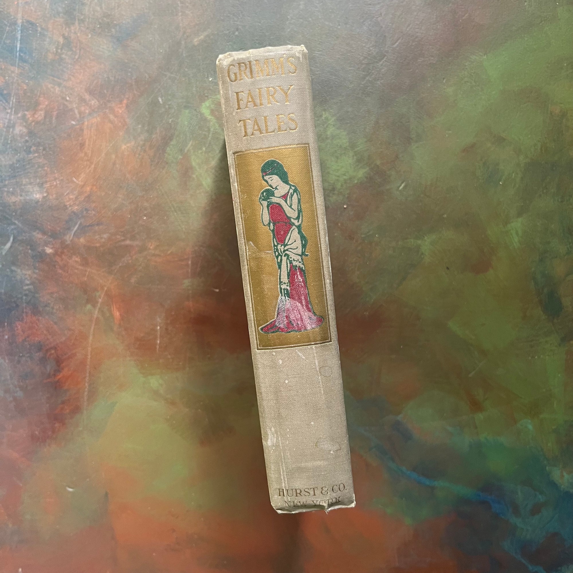 Grimm's Fairy Tales-The Brother's Grimm-Hurst & Co.-1910-1919-antique fairy tales for children-vintage children's book-view of the spine with title in gilt as well as a book specific illustration