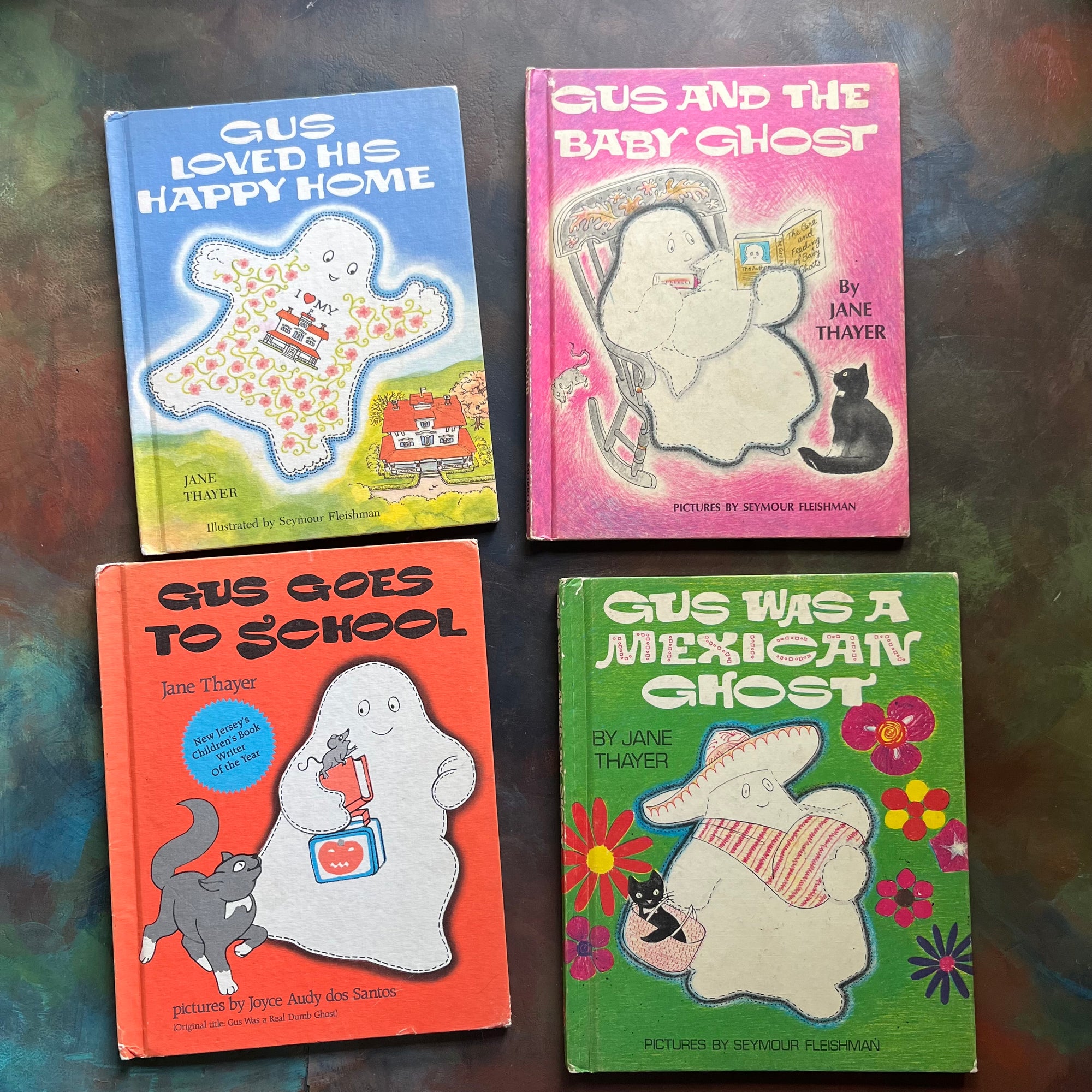 vintage children's picture books - Gus The Ghost Book Set Written by Jane Thayer with illustrations by Seymour Fleishman & Joyce Audy dos Santos: Titles - Gus Goes to School, Gus and the Baby Ghost, Gus Loved His Happy Home, and Gus Was a Mexican Ghost - view of the front covers