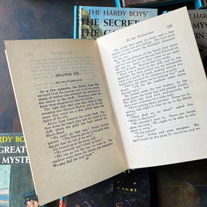 Hardy Boys Mysteries written by Franklin W. Dixon - this is a Starter Set of Volumes 1-10-vintage children's mystery books-wholesome kids books for the whole family-view of the view of the page tear at the spine