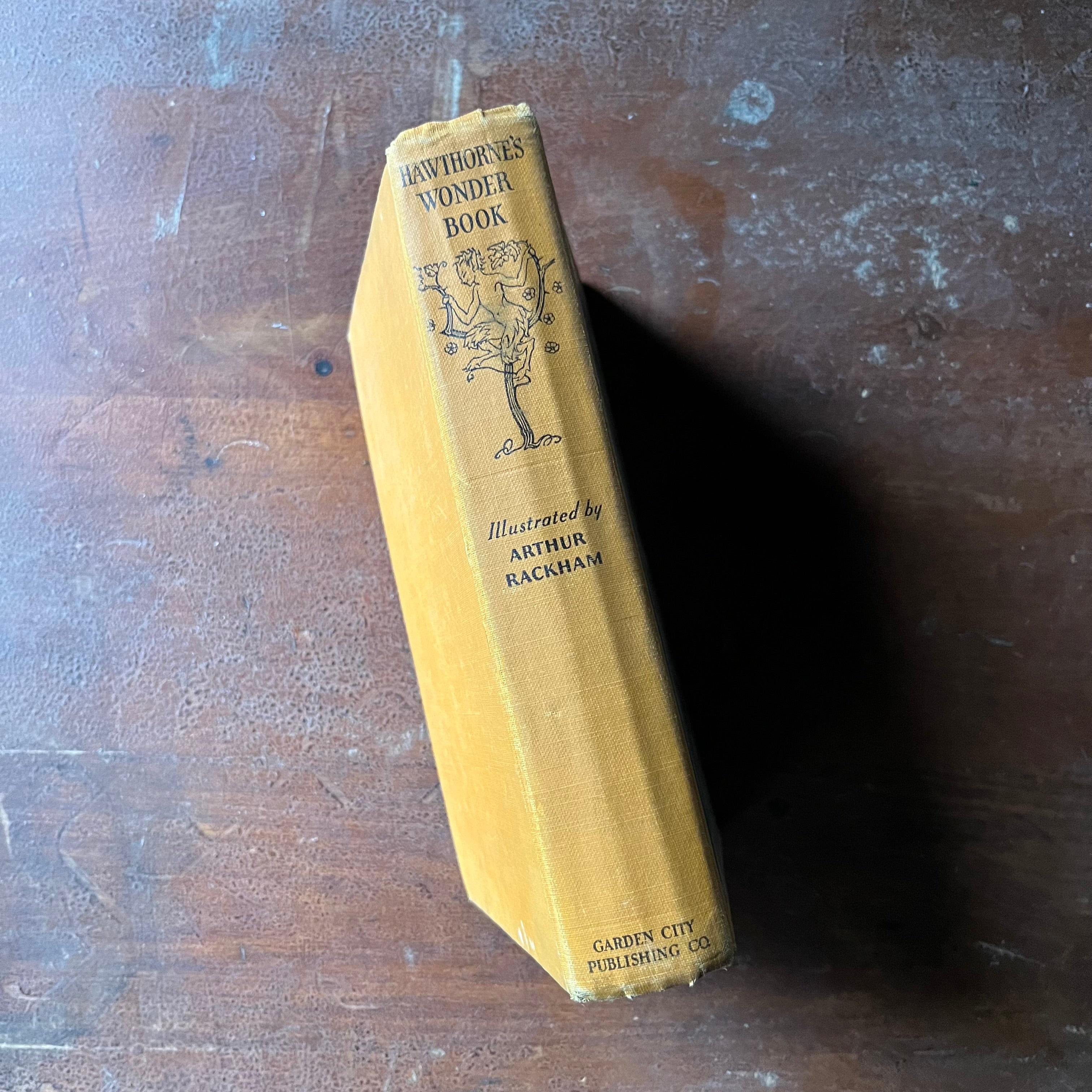 vintage children's fairy tales & folk lore - Hawthorne's Wonder Book written by Nathaniel Hawthorne with illustrations by Arthur Rackman - view of the spine with a sprite in a tree