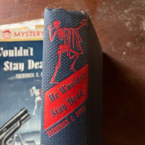 A Sundial Mystery, vintage mystery novel  - He Wouldn't Stay Dead written by Frederick C. Davis - view of the closeup of the dancing skeleton on the spine