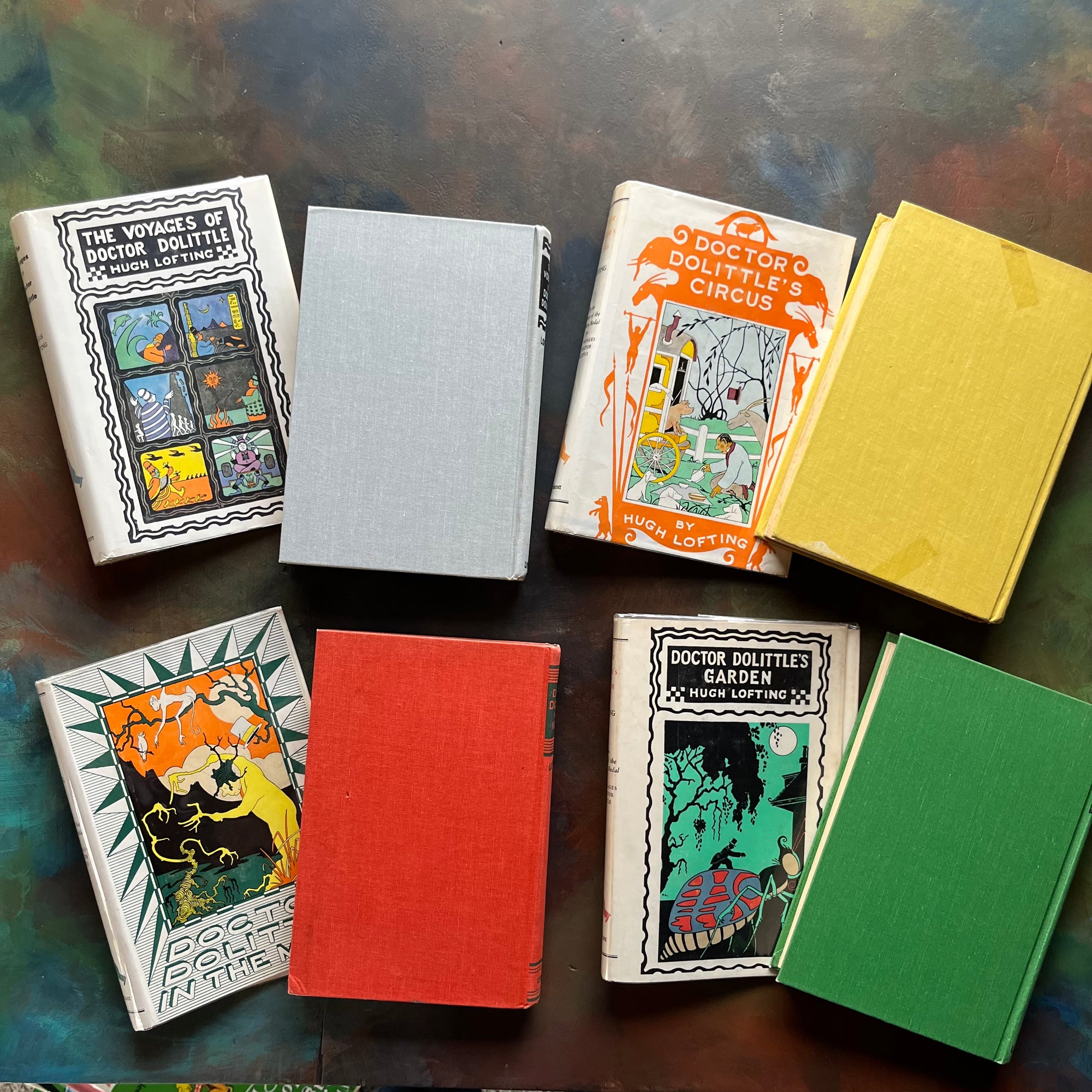 Hugh Lofting-Doctor Dolittle's Circus, Doctor Dolittle's Garden, Doctor Dolittle in the Moon and The Voyage of Doctor Dolittle-children's chapter books-view of the colorful back covers