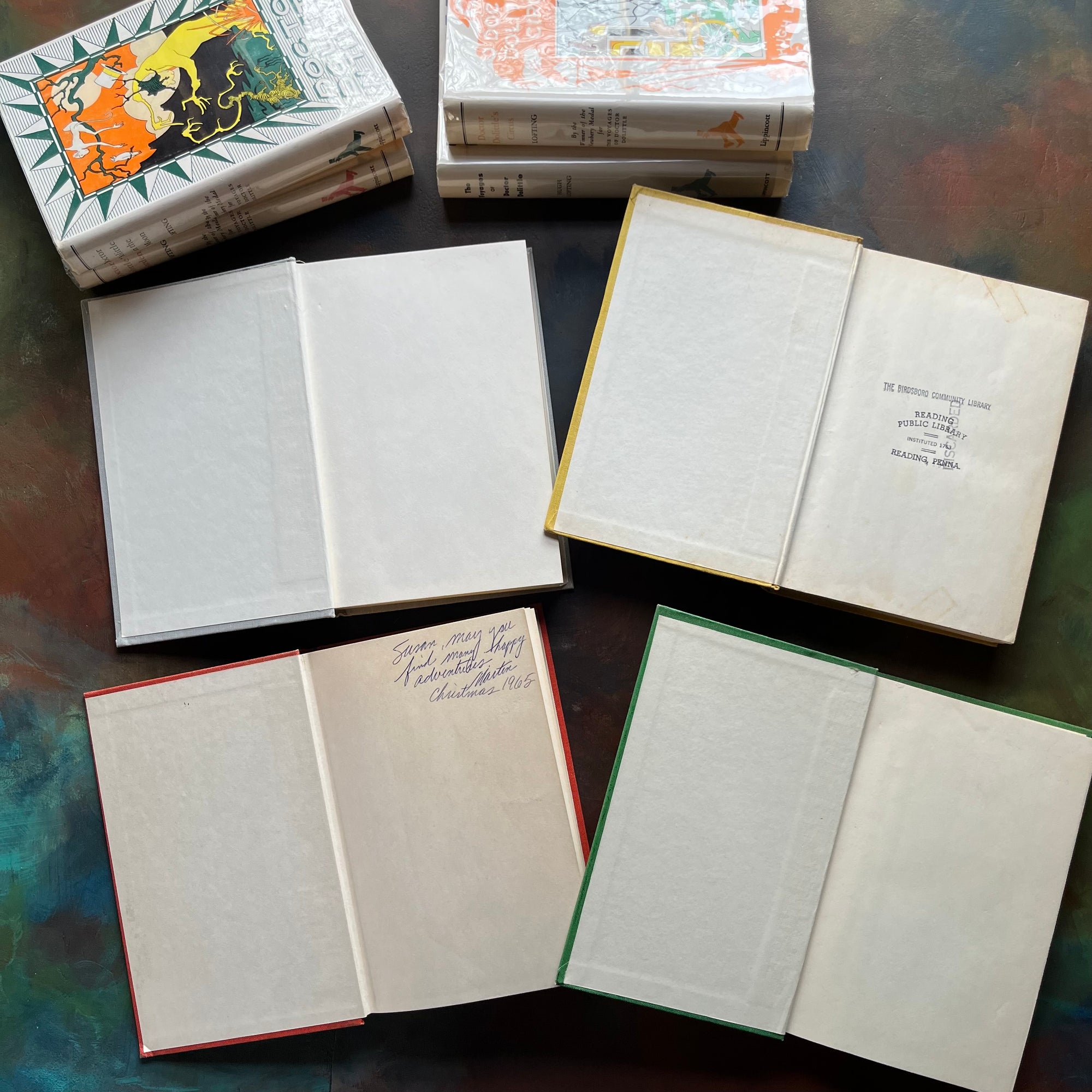 Hugh Lofting-Doctor Dolittle's Circus, Doctor Dolittle's Garden, Doctor Dolittle in the Moon and The Voyage of Doctor Dolittle-children's chapter books-view of the inside covers - one with a school stamp & another with a name & address written in ink