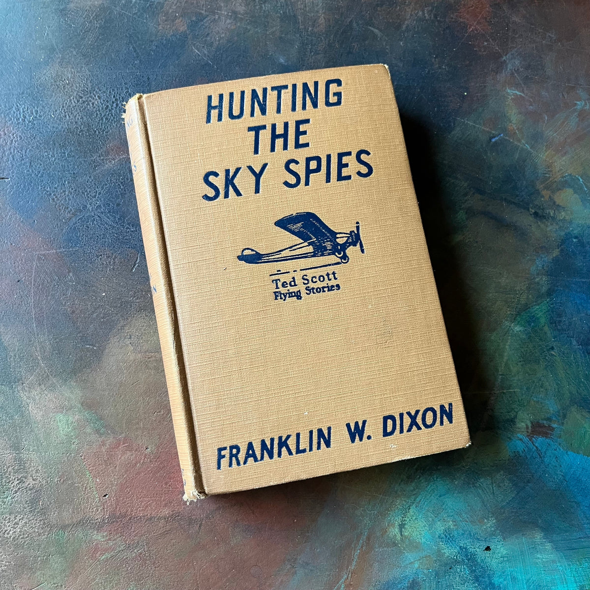 Hunting the Sky Spies #19 in the Ted Scott Flying Stories Series written by Franklin W. Dixon-vintage mystery books for boys-mystery book series-view of the embossed front cover