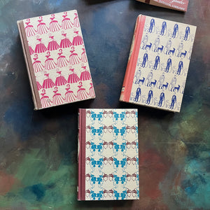 Illustrated Junior Library Editions Book Set-Little Women-Little Men-Jo's Boys- written by Louisa May Alcott-classic children's literature-view of the front covers with repeating designs across the covers relevant to each book title
