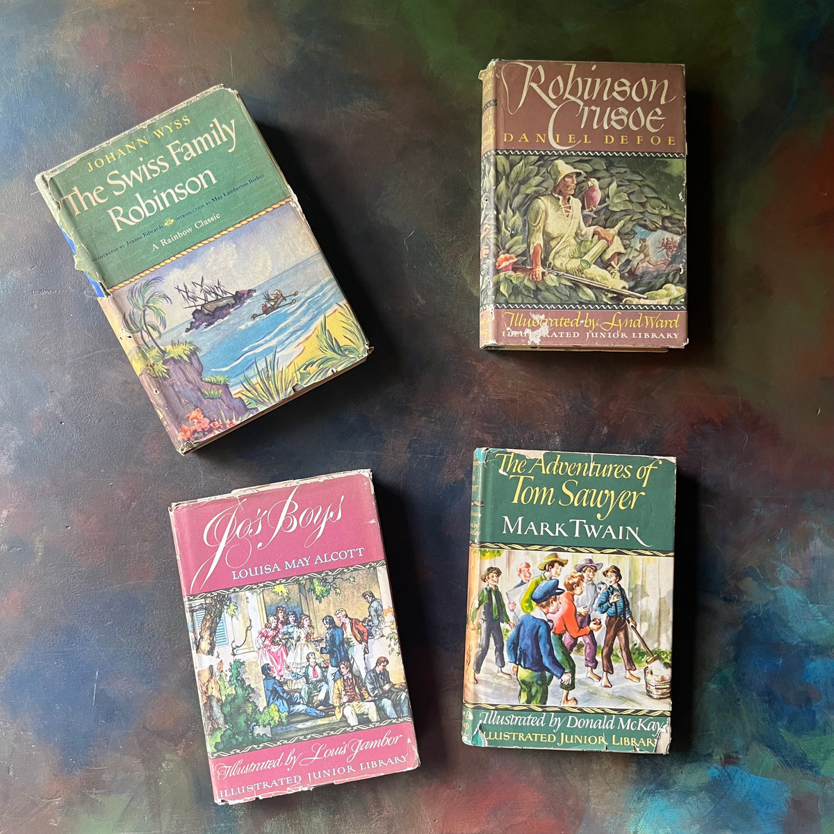 Illustrated Junior Library Editions Book Set-The Adventures of Tom Sawyer-Jo's Boys-Robinson Crusoe-The Swiss Family Robinson-classic children's literature-view of the dust jacket's front covers