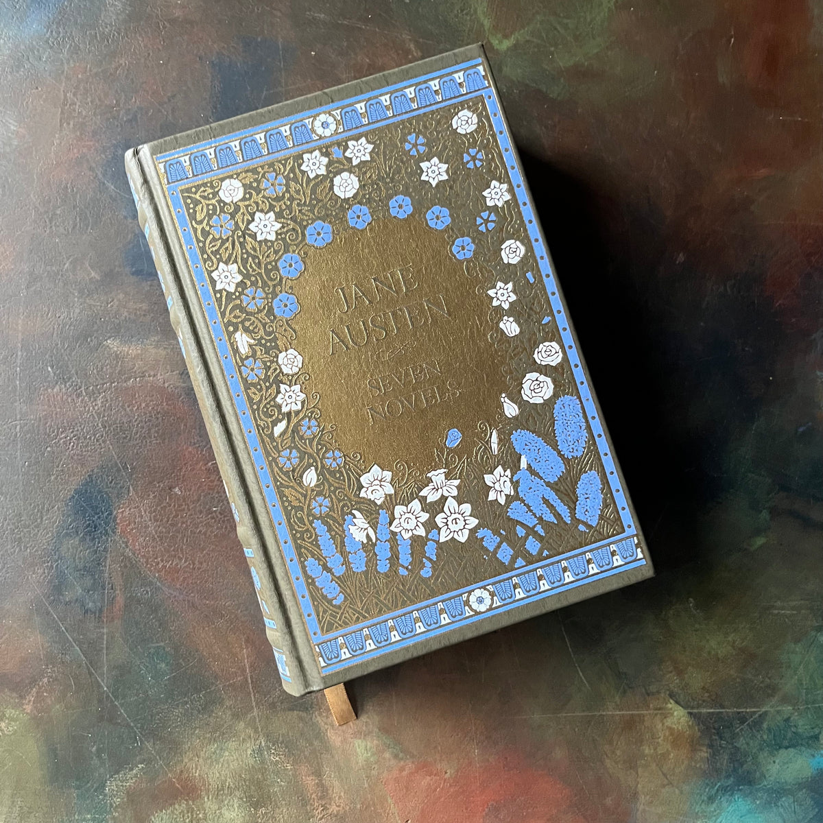 Jane Austen Seven Novels -Barnes and Noble Collectible Editions-Leatherbound Gift Book-Classic English Literature-view of the decorative, embossed front cover in blue, gold & white floral designs