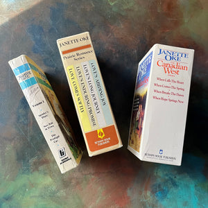 Janette Oke Book Set-Canadian West Series-Prairie Romance Series-Classic Collection-vintage Christian Fiction-spines-view of the back of the book sleeves listing the titles included in each sleeve