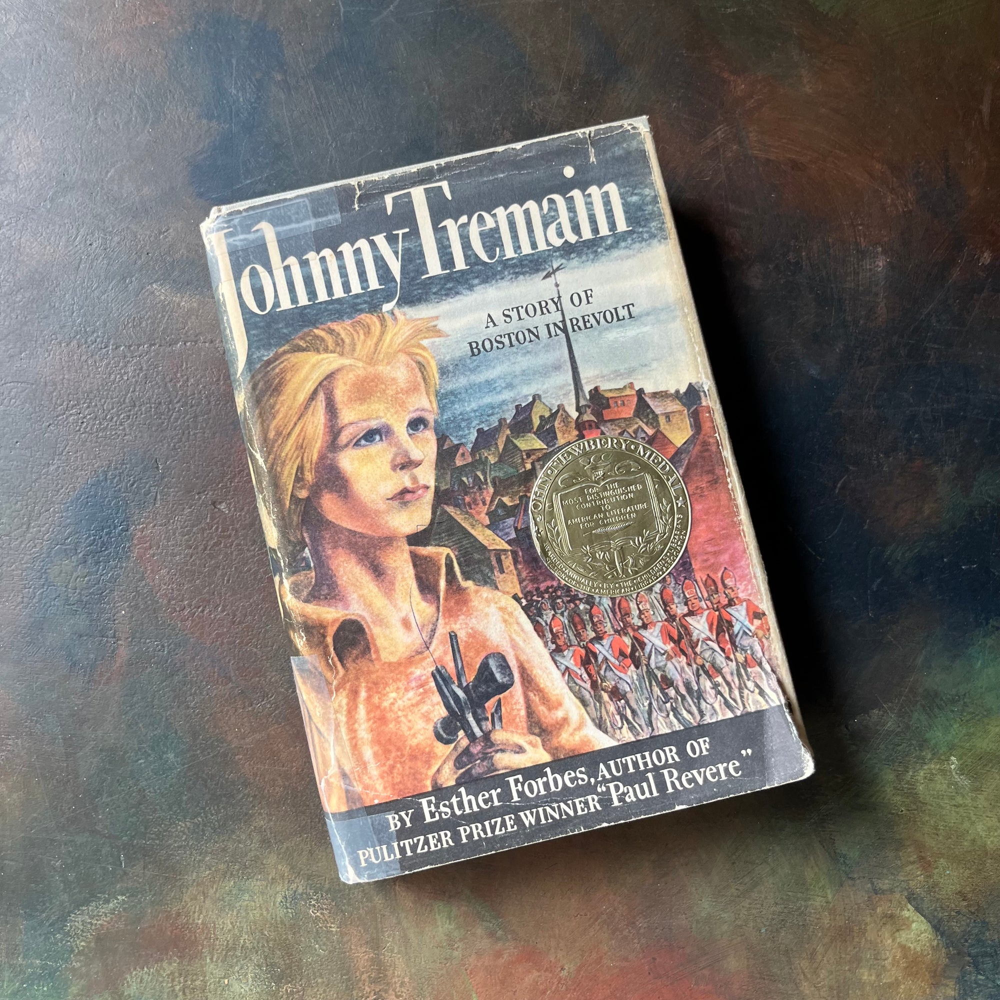 Johnny Tremain The Story of Boston in Revolt-Esther Forbes-1944 Newbery Award Winner-Lynd Ward-vintage living history book-view of the illustrated front cover with the Newbery Medal Seal attached