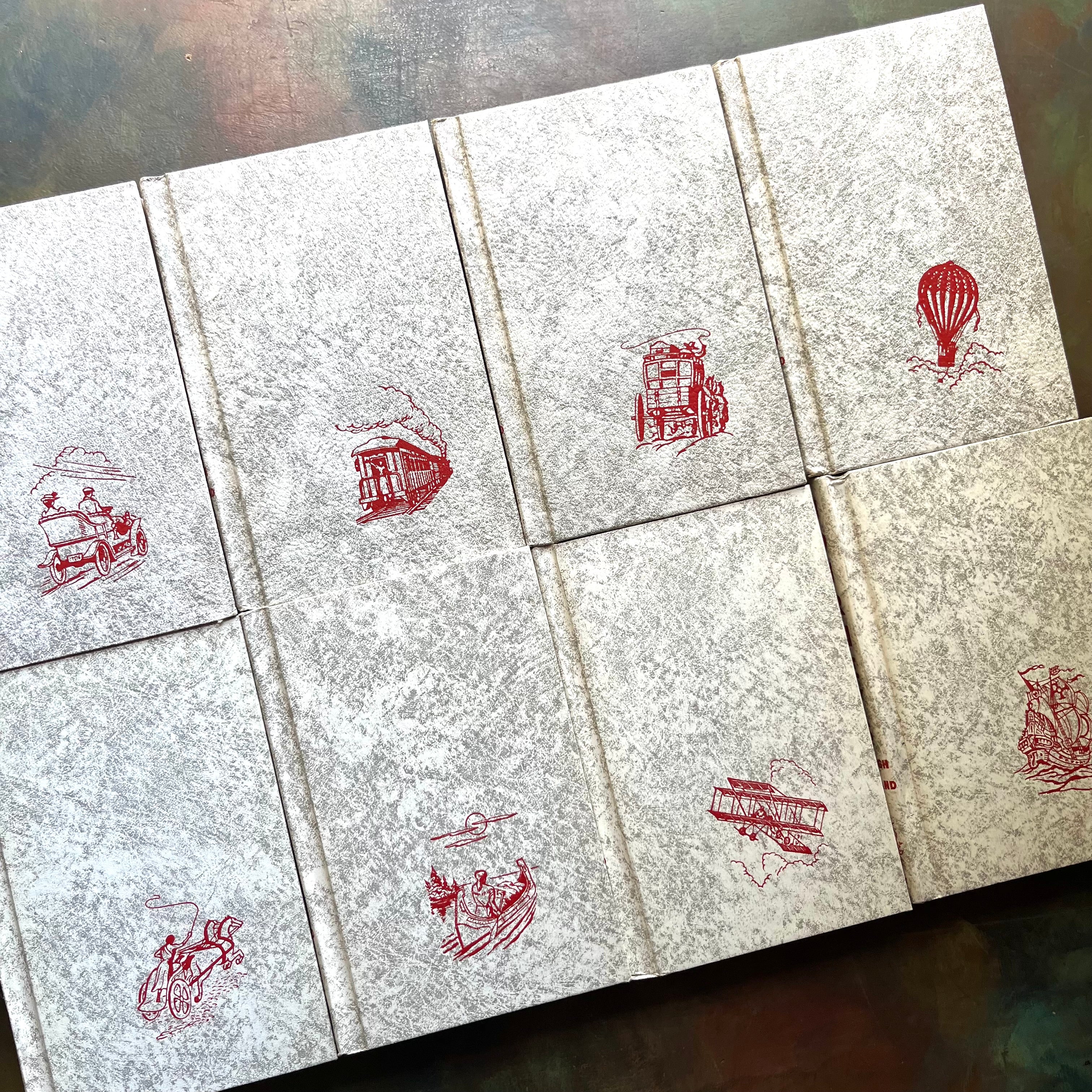 Journeys Through Bookland-Vintage 8-Volume Set-1955 Edition-classic literature anthology-view of the front covers in the same white marbled design with red images in the bottom right hand corner of each volume
