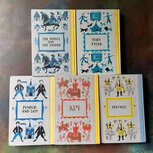 Junior Deluxe Editions Book Set-Adventure & Mischief Themed Books for Boys-Kim-Freckles-Toby Tyler-Classic Children's Literature-view of the embossed back covers