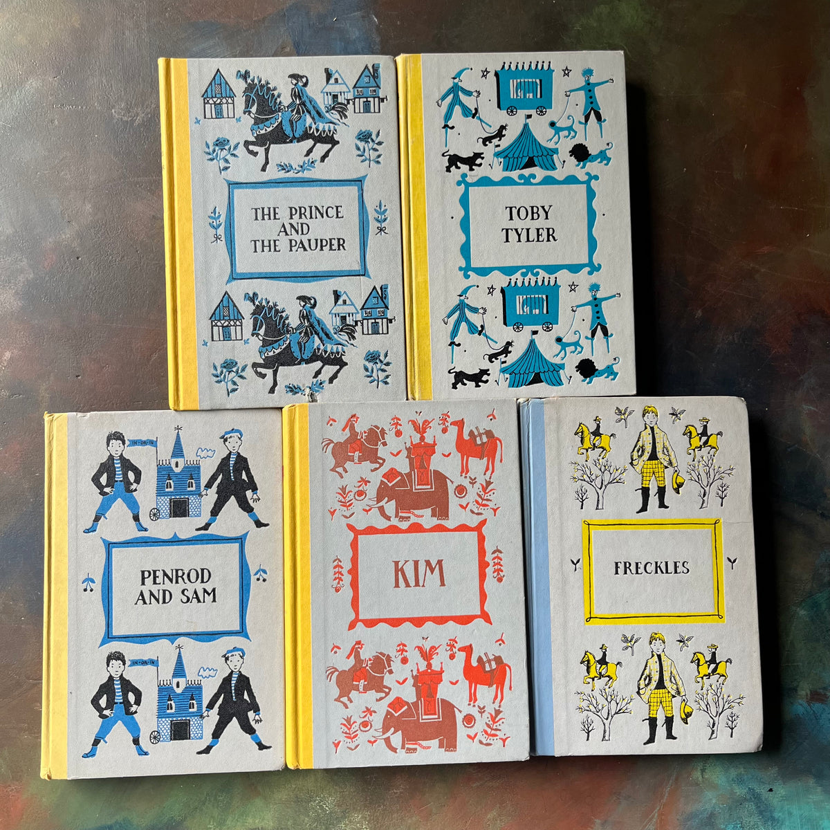 Junior Deluxe Editions Book Set-Adventure & Mischief Themed Books for Boys-Kim-Freckles-Toby Tyler-Classic Children's Literature-view of the embossed front covers