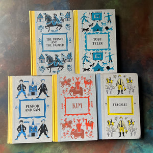 Junior Deluxe Editions Book Set-Adventure & Mischief Themed Books for Boys-Kim-Freckles-Toby Tyler-Classic Children's Literature-view of the embossed front covers