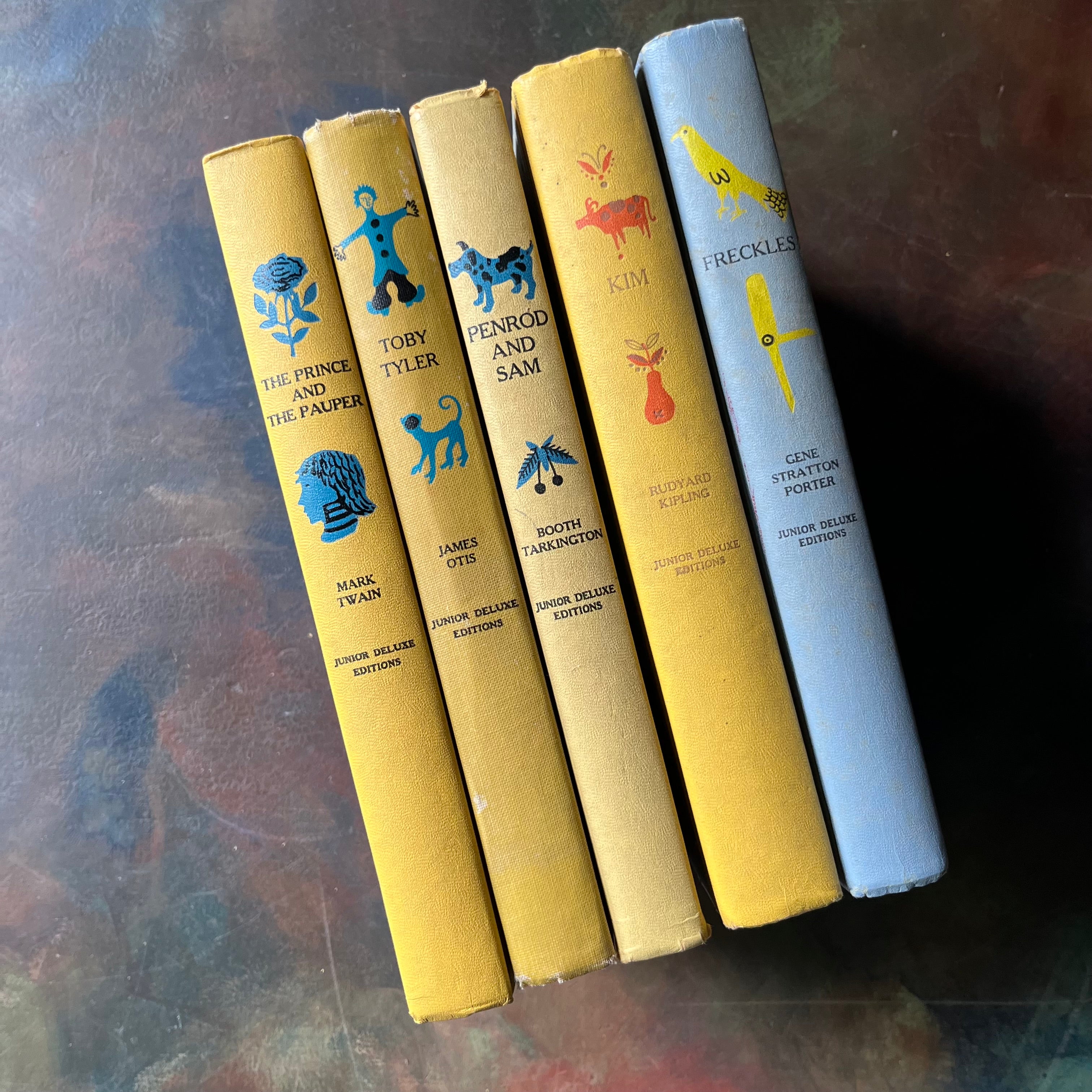 Junior Deluxe Editions Book Set-Adventure & Mischief Themed Books for Boys-Kim-Freckles-Toby Tyler-Classic Children's Literature-view of the spines