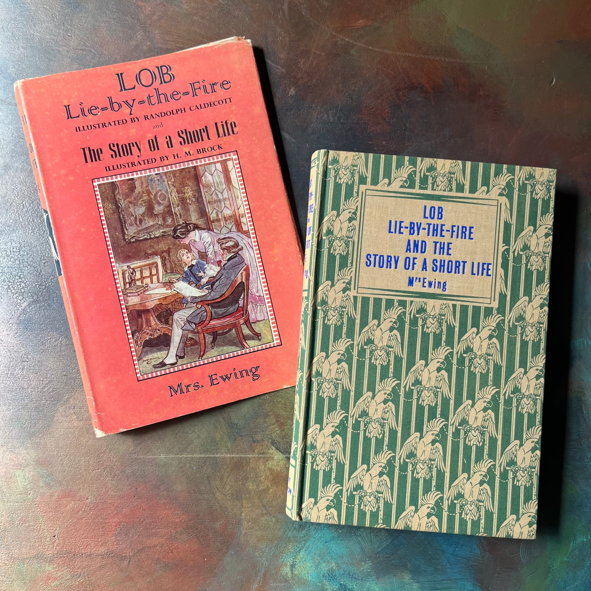 Lob Lie by the Fire The Story of a Short Life by Mrs. Ewing-vintage Dent Dutton Children's Classic Edition-vintage children's chapter book-view of the front cover with a green background with white parrots in a repeating design