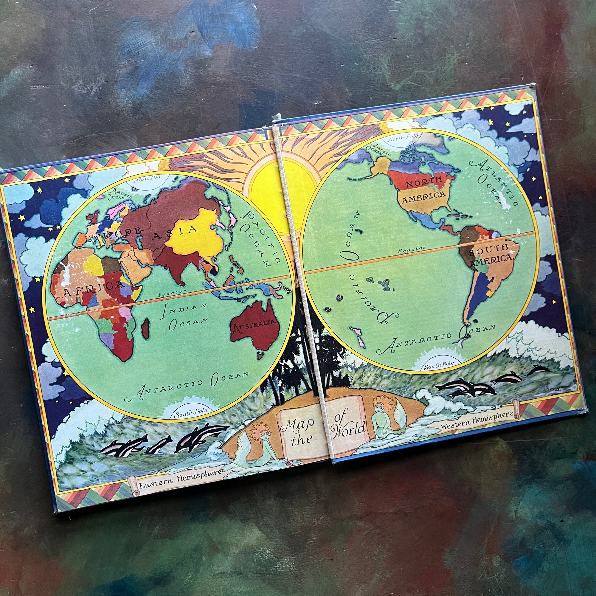 Little Folks of Other Lands written by Watty Piper-with illustrations by Lucille and Holling C. Holling-vintage world geography study-vintage children's book-view of the back, inside cover showing the same world map as the inside front cover