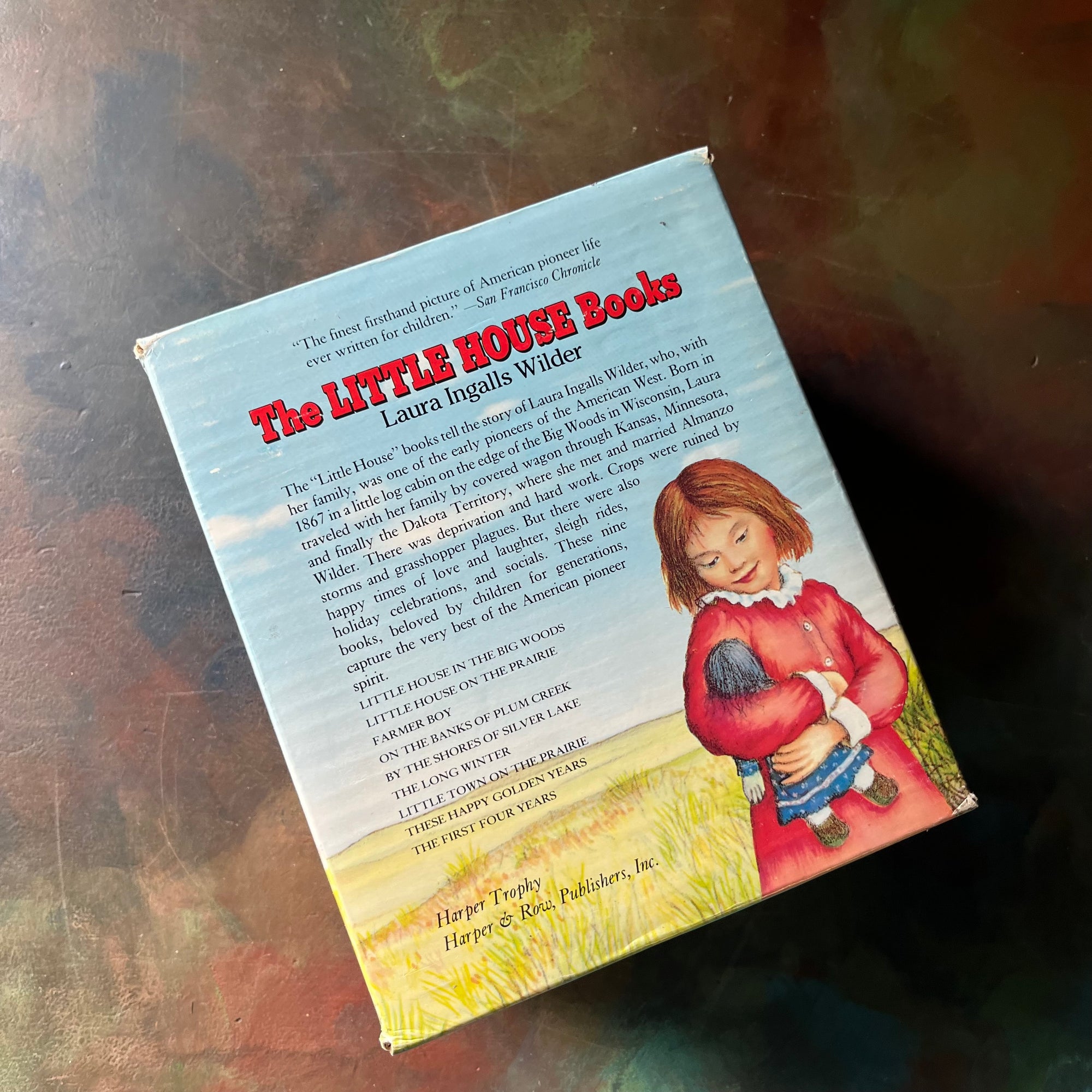 Little House on the Prairie Box Set in Blue written by Laura Ingalls Wilder with Illustrations by Garth Williams-vintage children's chapter books-view of the back of the box sleeve