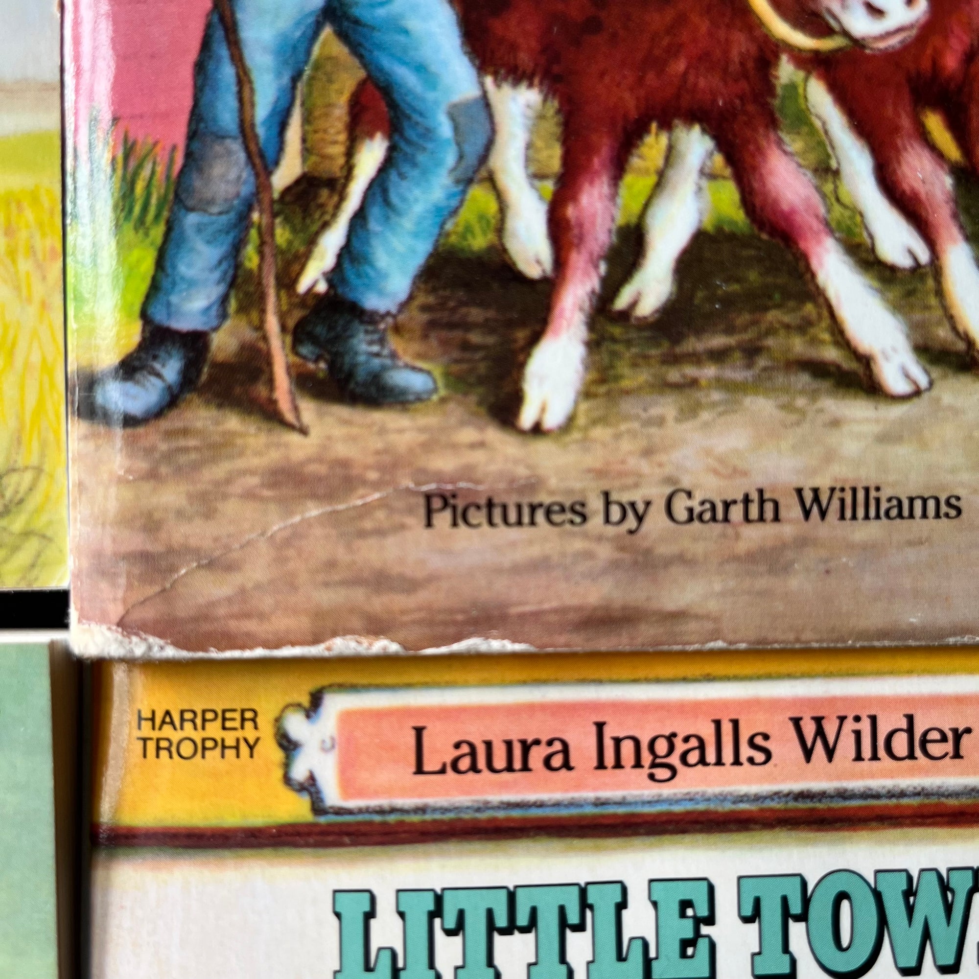 Little House on the Prairie Box Set in Blue written by Laura Ingalls Wilder with Illustrations by Garth Williams-vintage children's chapter books-view of the condition of the bottom of the cover of Farmer Boy
