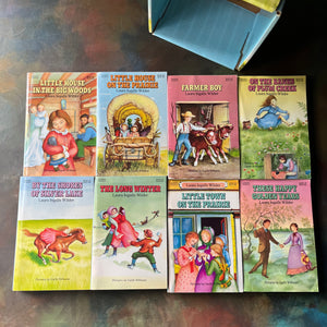 Little House on the Prairie Box Set in Blue written by Laura Ingalls Wilder with Illustrations by Garth Williams-vintage children's chapter books-view of the front covers