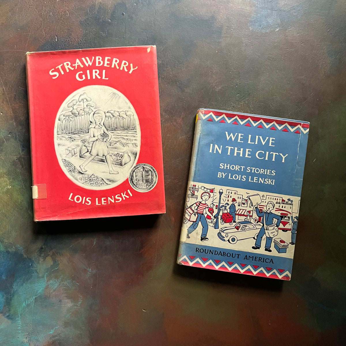 Lois Lenski 2-Book Set–Strawberry Girl and We Live in the City-vintage children's books-round-about America Book Series-Newbery Award Book-view of the dust jacket's front covers