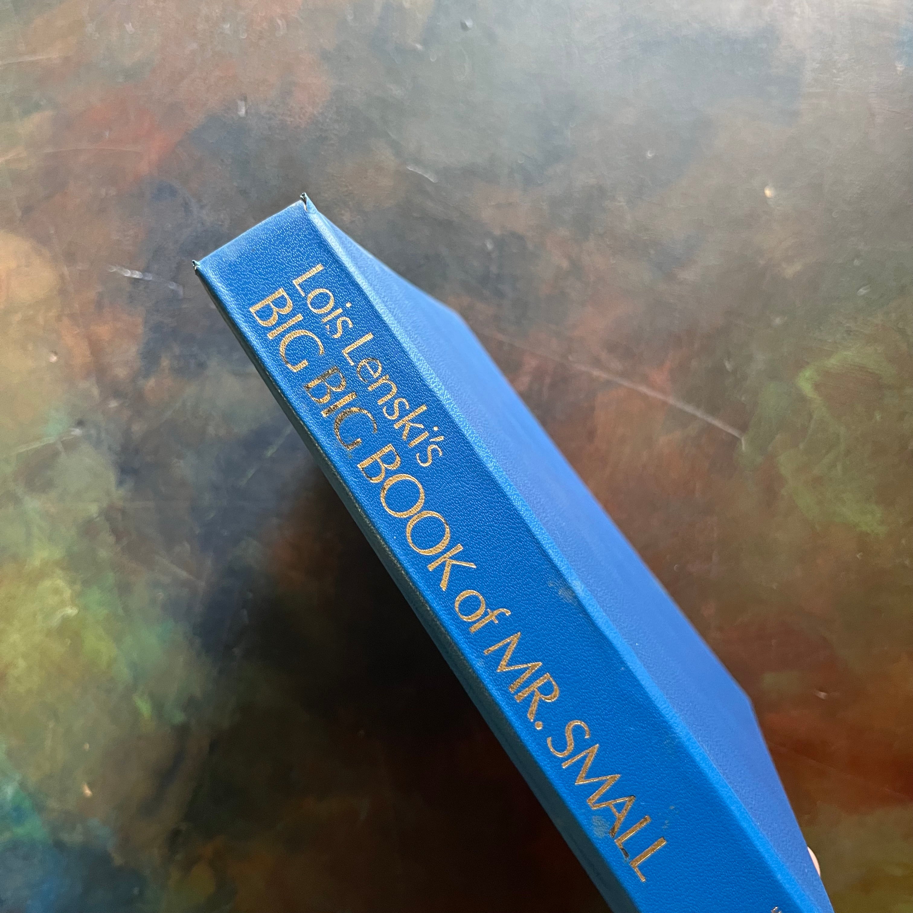 Lois Lenski's Big Book of Mr. Small-Policeman Small-Cowboy Small-The Little Farm-The Little Auto-The Little Sail Boat-The Little Airplane-Six picture book stories written and illustrated by Lois Lenski all in one book-1930's children's vintage picture books-view of the spine with gold lettering against a royal blue background