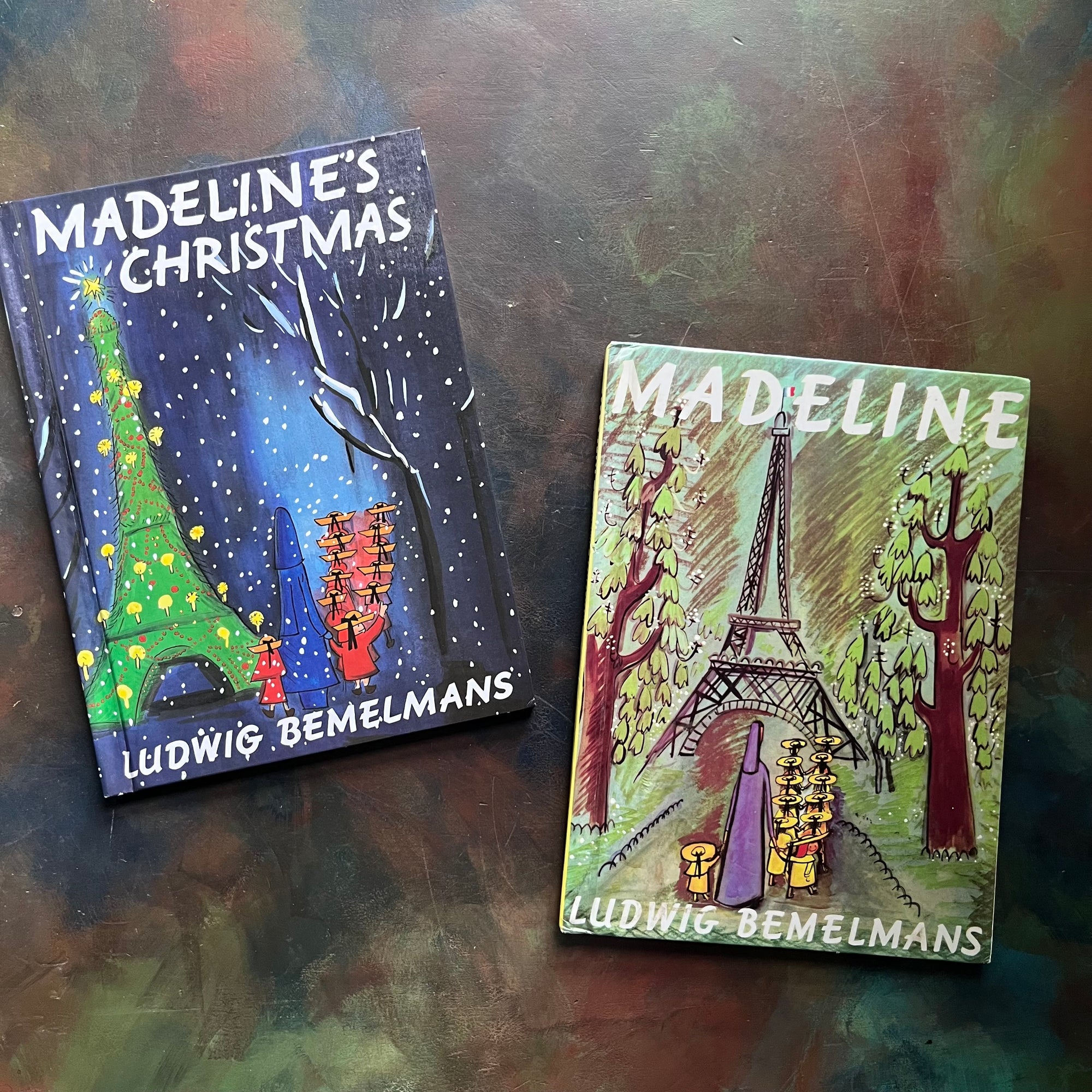 Madeline- and Madeline's Christmas written and illustrated by Ludwig Bemelmans-Caldecott Honor winner-vintage children's picture books-view of the colorful front covers with the iconic image of a nun walking with little girls in two rows