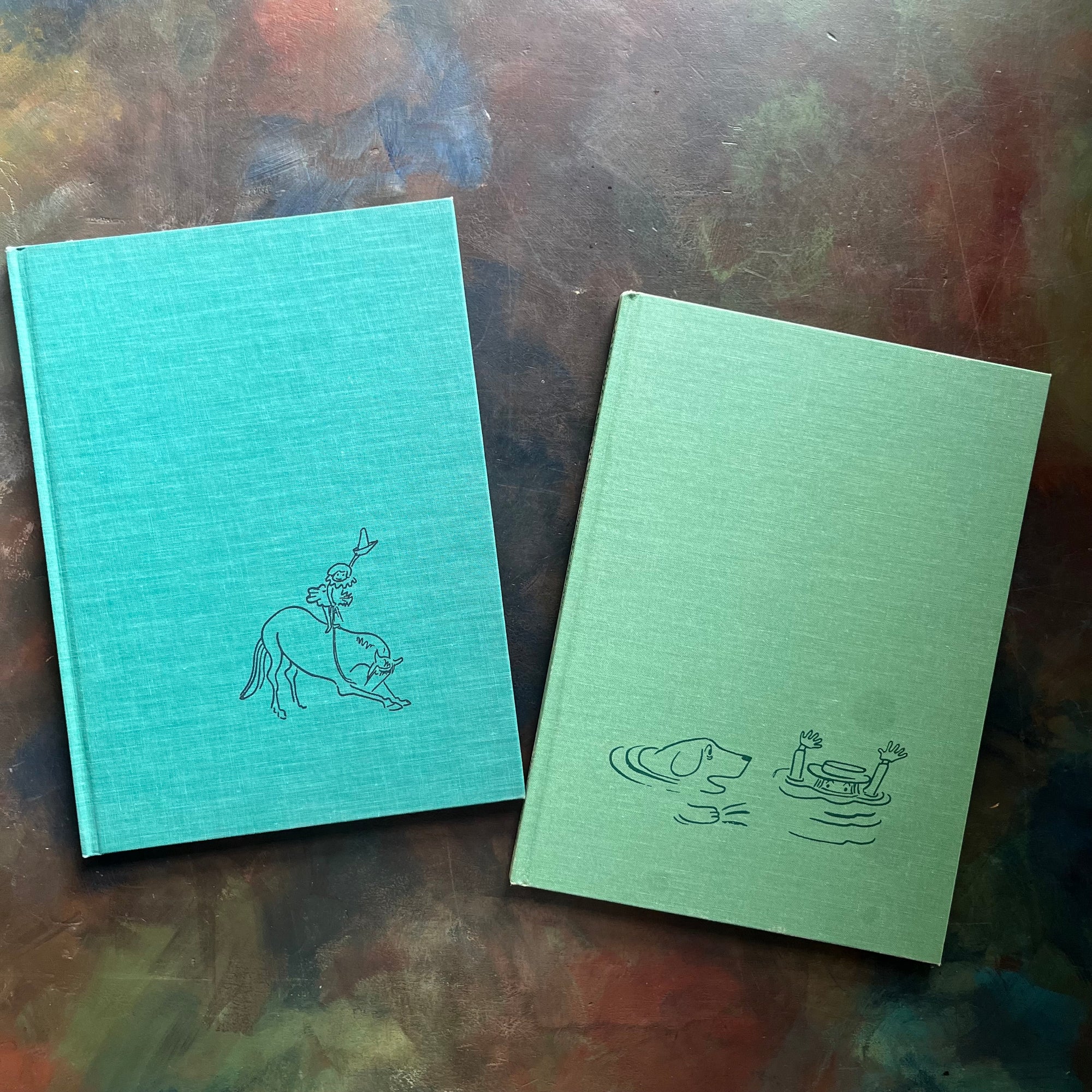 Madeline's Rescue (1954 Caldecott Winner)-Madeline and the Gypsies-written and illustrated by Ludwig Bemelmans-Caldecott winner-vintage children's picture books-view of the clothbound front covers with images depicting a scene from each book