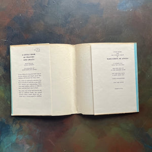 Marguerite de Angeli's A Pocket Full of Posies-A Little Book of Prayers and Graces by Quail Hawkins-first prayer book-view of the dust jacket's inside flaps - note they are intact & have not been clipped