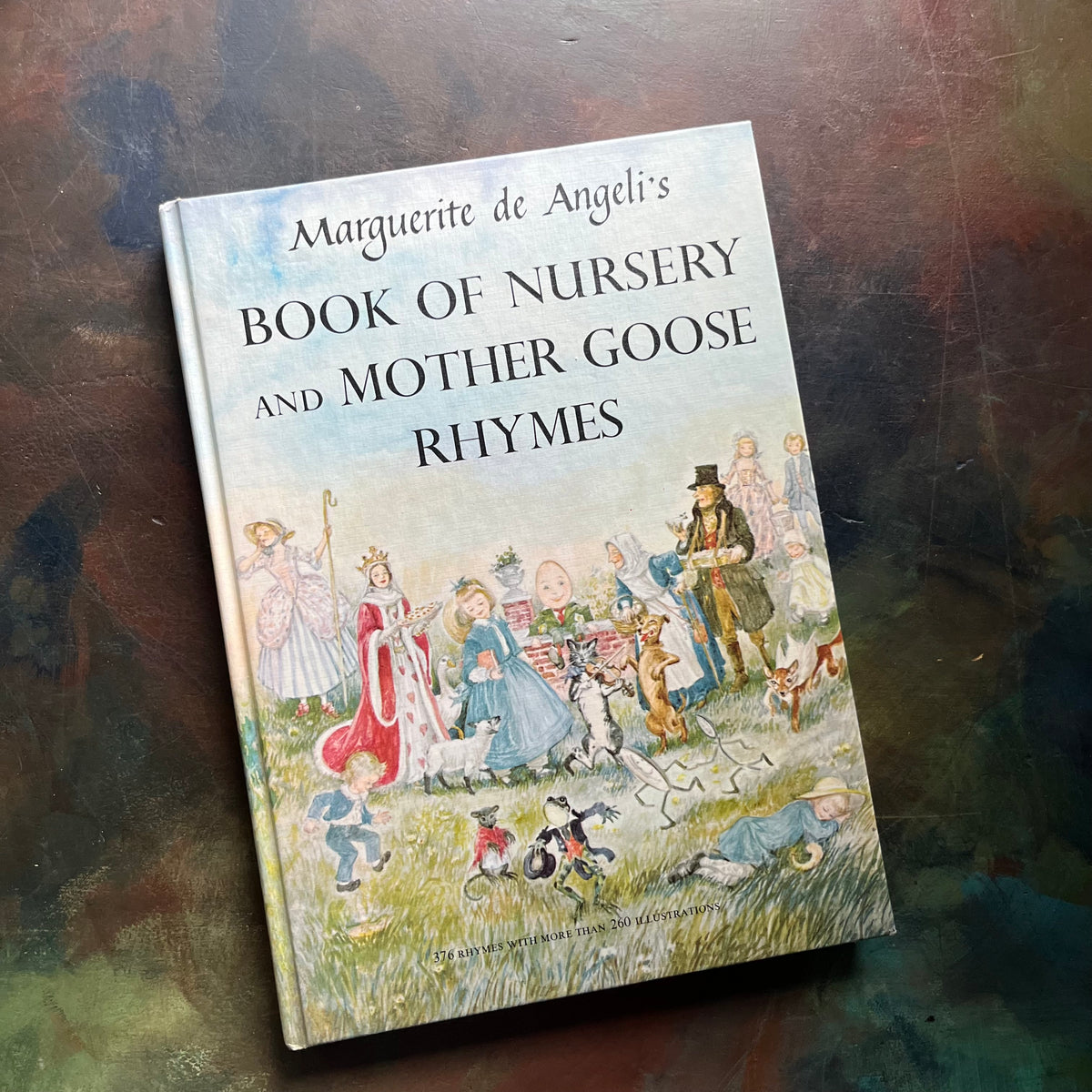 Marguerite de Angeli's Book of Nursery and Mother Goose Rhymes-vintage children's book-Caldecott honor book-view of the front cover with mother goose characters illustrated together