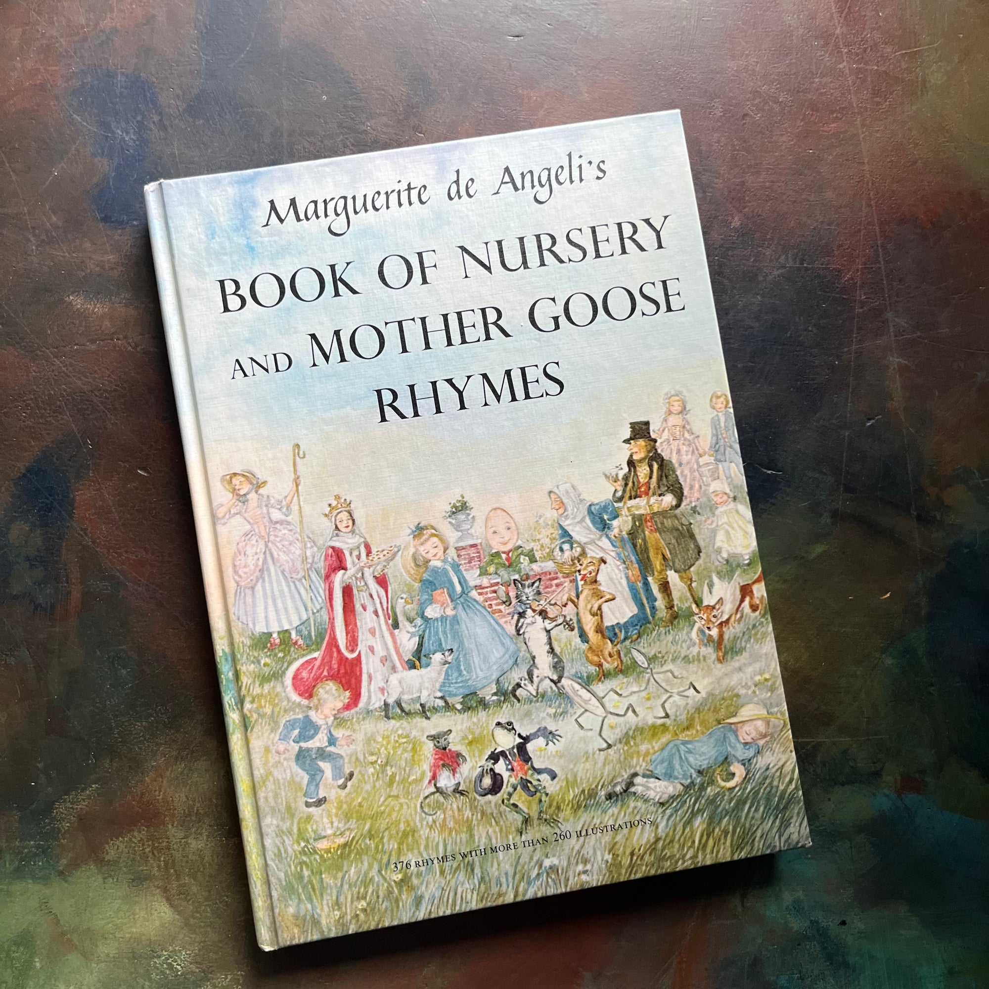 Marguerite de Angeli's Book of Nursery and Mother Goose Rhymes-vintage children's book-Caldecott honor book-view of the front cover with mother goose characters illustrated together