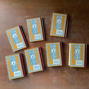vintage children's books, children's school primers - McGuffey's Eclectic Readers Primer Through the Sixth written by William Holmes McGuffey - Complete Book Set in Cardboard Sleeve - view of the back of the books