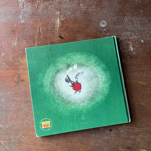 Mike Mulligan and his Steam Shovel Written & Illustrated by Virginia Lee Burton-Weekly Reader Children's Book-vintage children's picture book-view of the back cover in green with the steam shovel in the middle & the weekly reader book club emblem in the bottom left hand corner