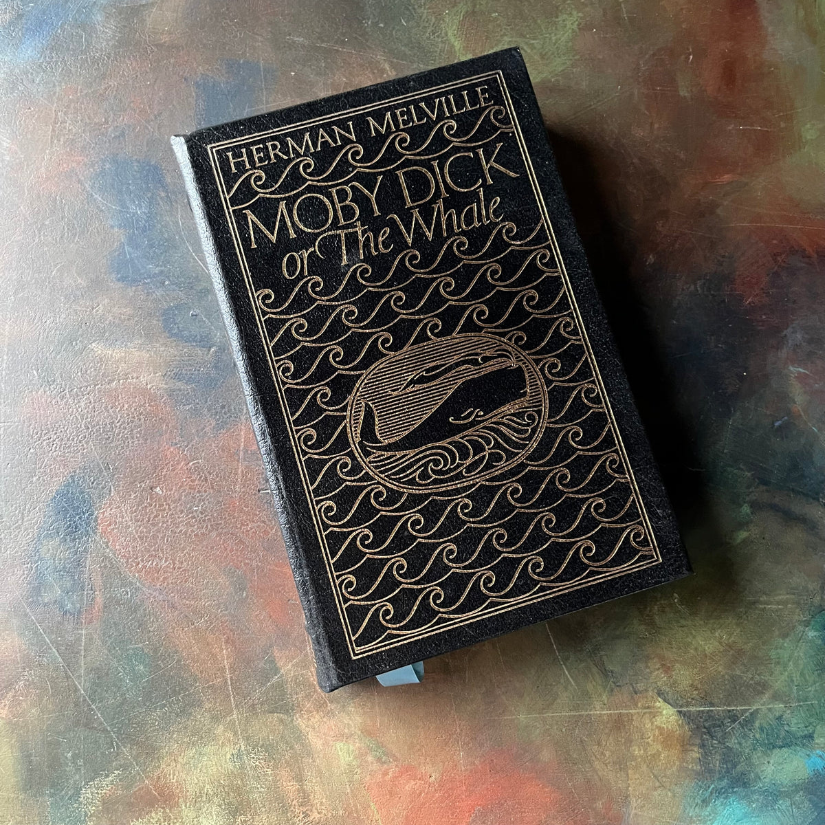 Moby Dick or the Whale-Herman Melville-1977 Easton Press Edition-classic American Literature-Gift Book-view of the embossed front cover in a navy blue & gold