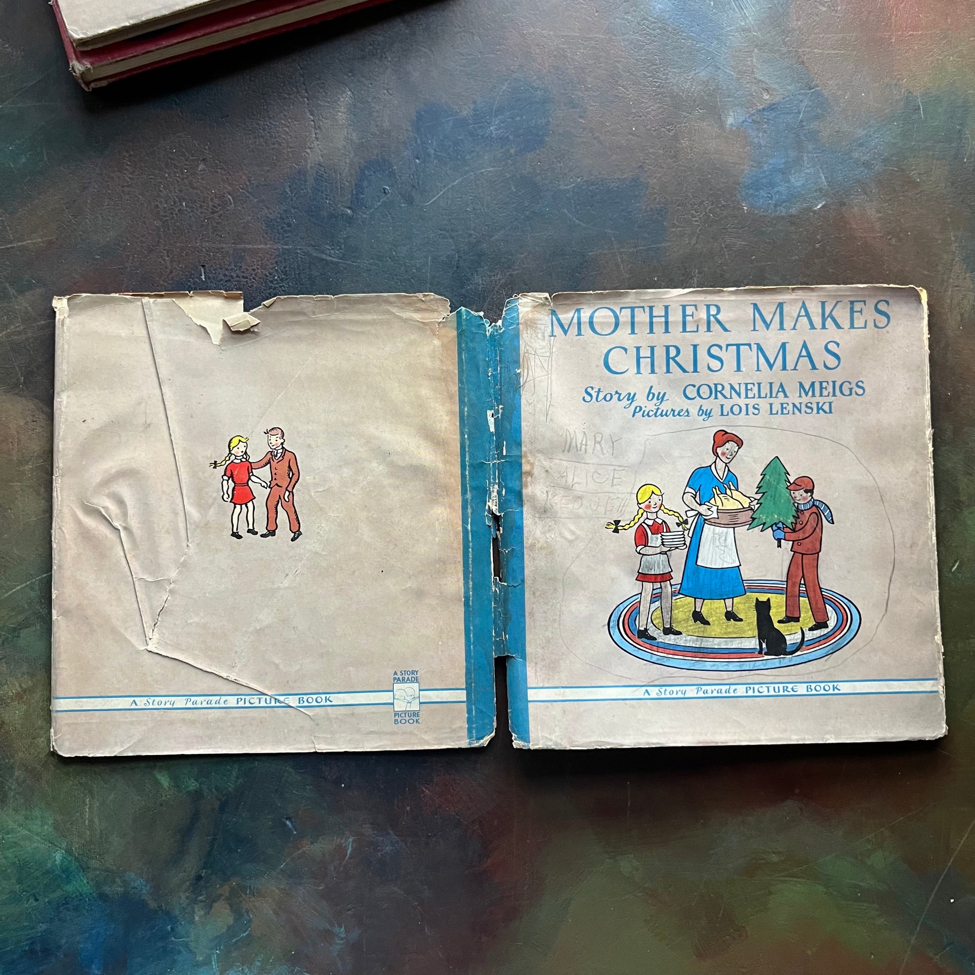 Mother Makes Christmas and Lois Lenski's Christmas Stories-wholesome family Christmas stories-vintage children's books-view of the outside of the dust jacket - note the wear around the edges and especially down the spine area