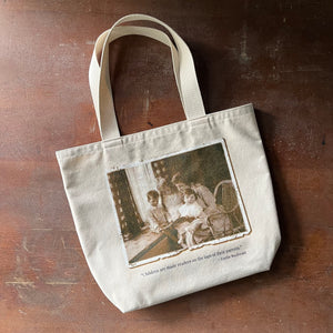 Log Cabin Vintage-canvas book tote bag-view of the front of the bag with a screenprint of an old photograph of a mother reading to three children