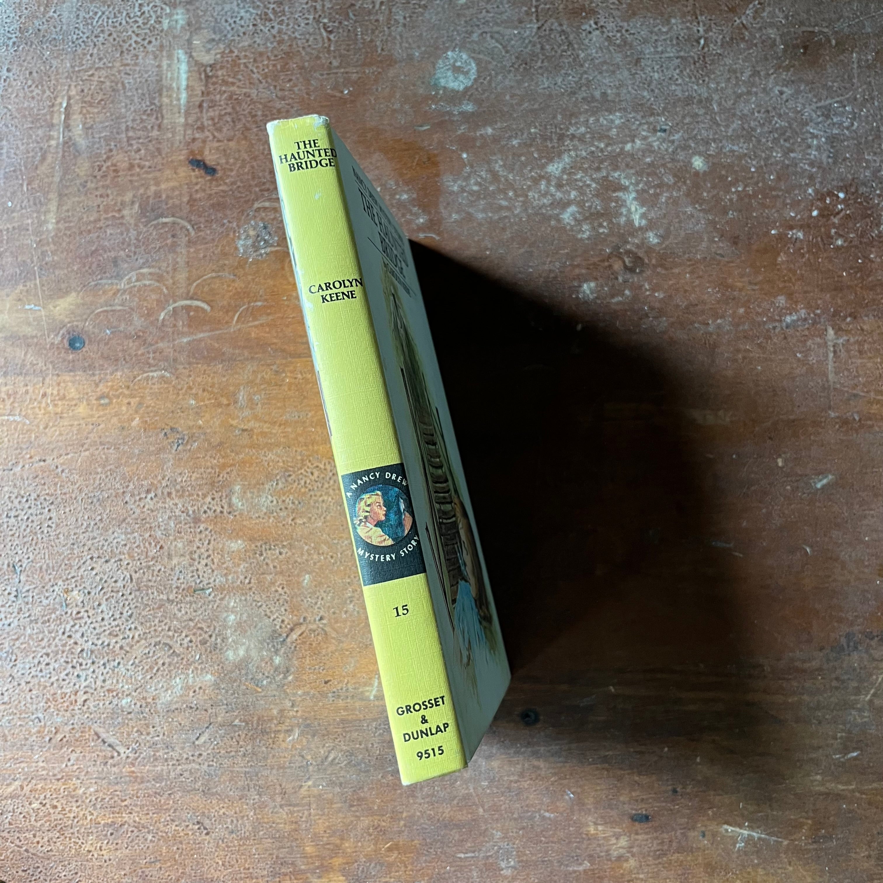 vintage children's chapter book, adventure book for girls, Nancy Drew Mystery Stories - #15 The Haunted Bridge written by Carolyn Keene - view of the spine