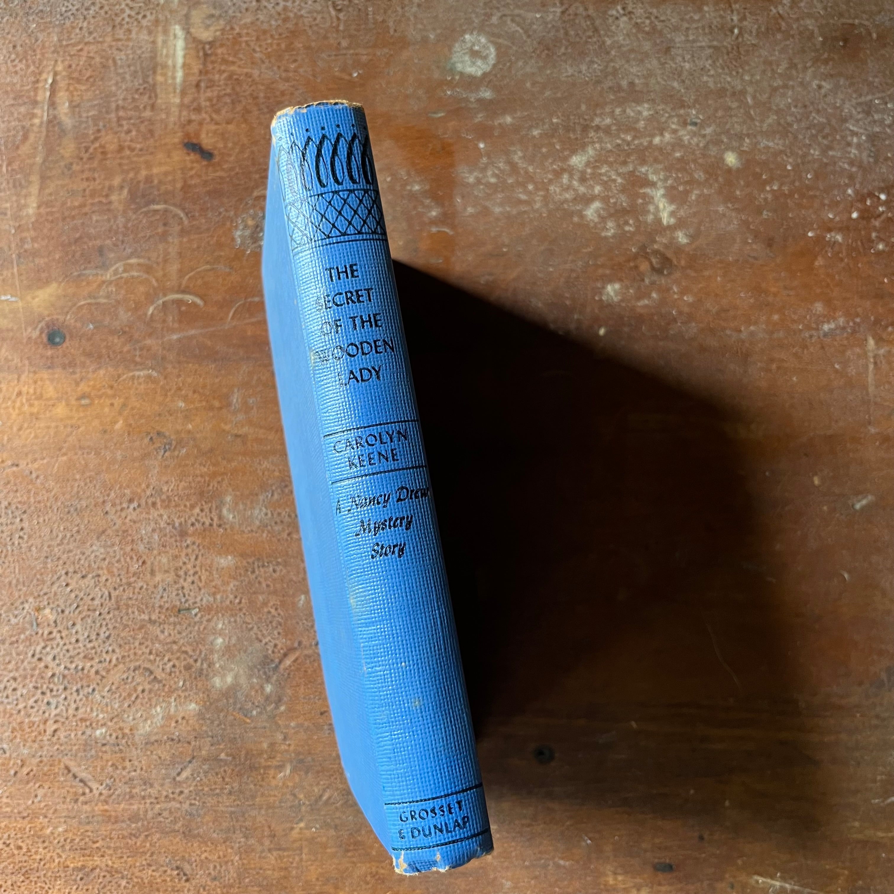 vintage children's chapter book, adventure book for girls, Nancy Drew Mystery Stories - #27 The Secret of the Wooden Lady written by Carolyn Keene - view of the spine