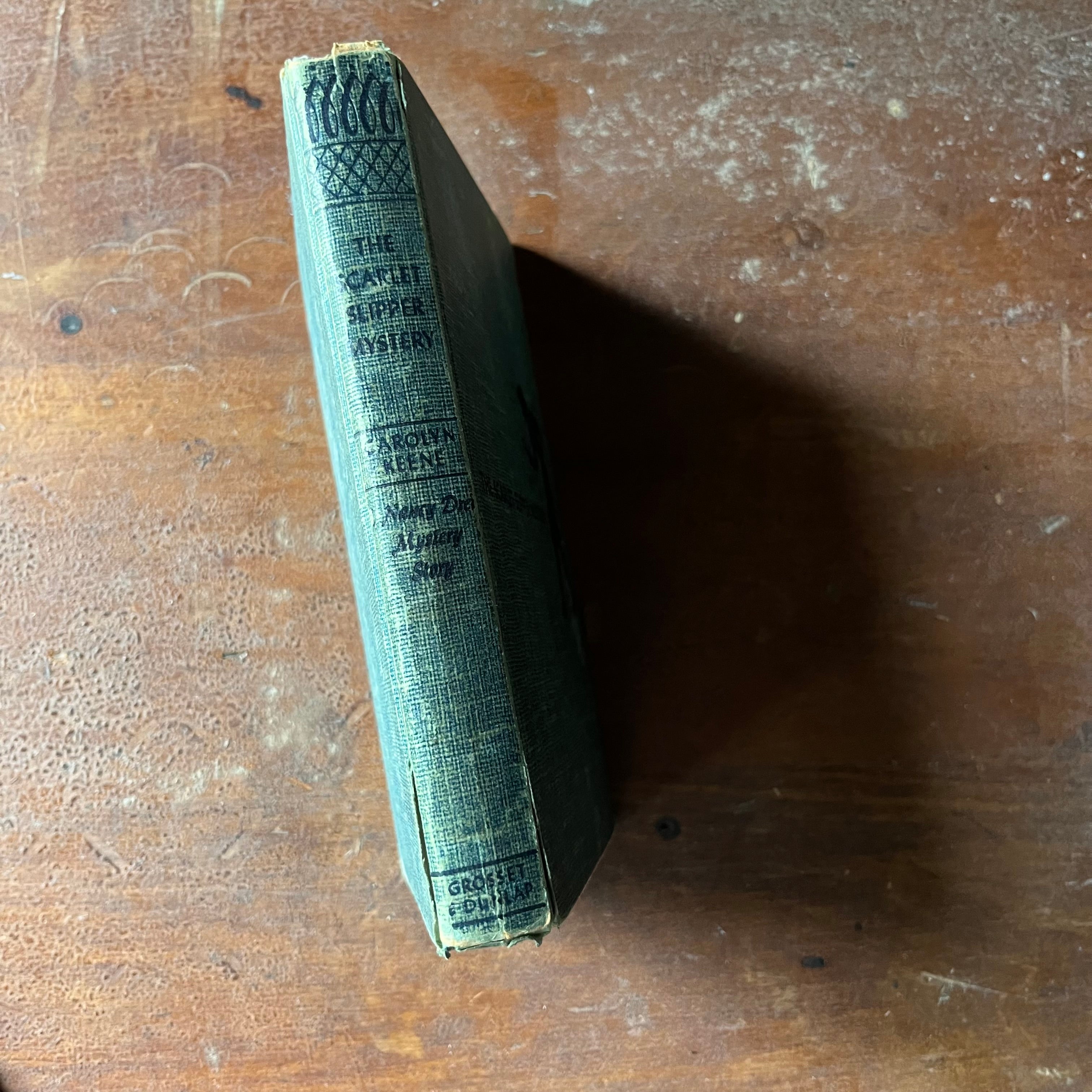 vintage children's chapter book. adventure book for girls, Nancy Drew Mystery Stories - #32 The Scarlet Slipper Mystery written by Carolyn Keene - view of the spine