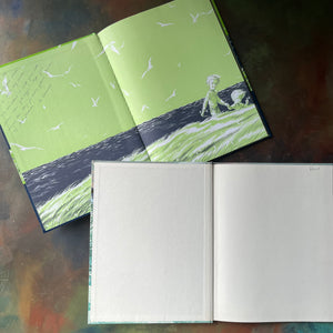 Pair of Vintage Children's Picture Books written & illustrated by Robert McCloskey-One Morning in Maine-Burt Dow Deep-Water Man-view of the inside covers - there is an inscription written inside of One Morning in Maine & a last name written in Burt Dow