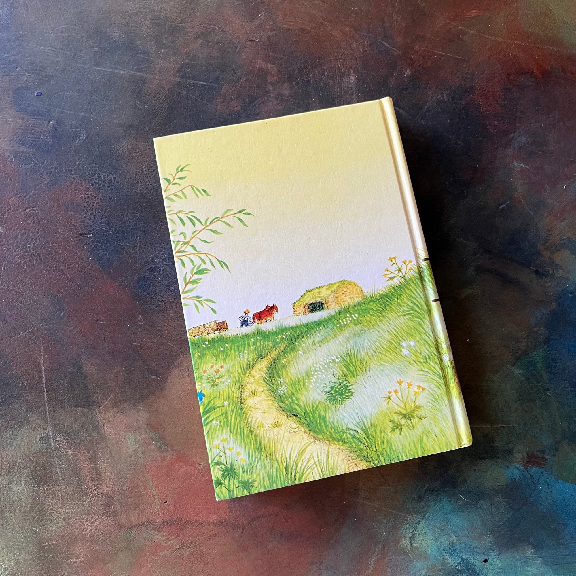 On the Banks of Plum Creek written by Laura Ingalls Wilder with illustrations by Garth Williams. This is a 1953 Edition by Harper & Row Publishers, New York & Evanston.  It was a 1938 Newbery Honor Book. 
 It is a vintage children's chapter book & living book.  View of the back cover.