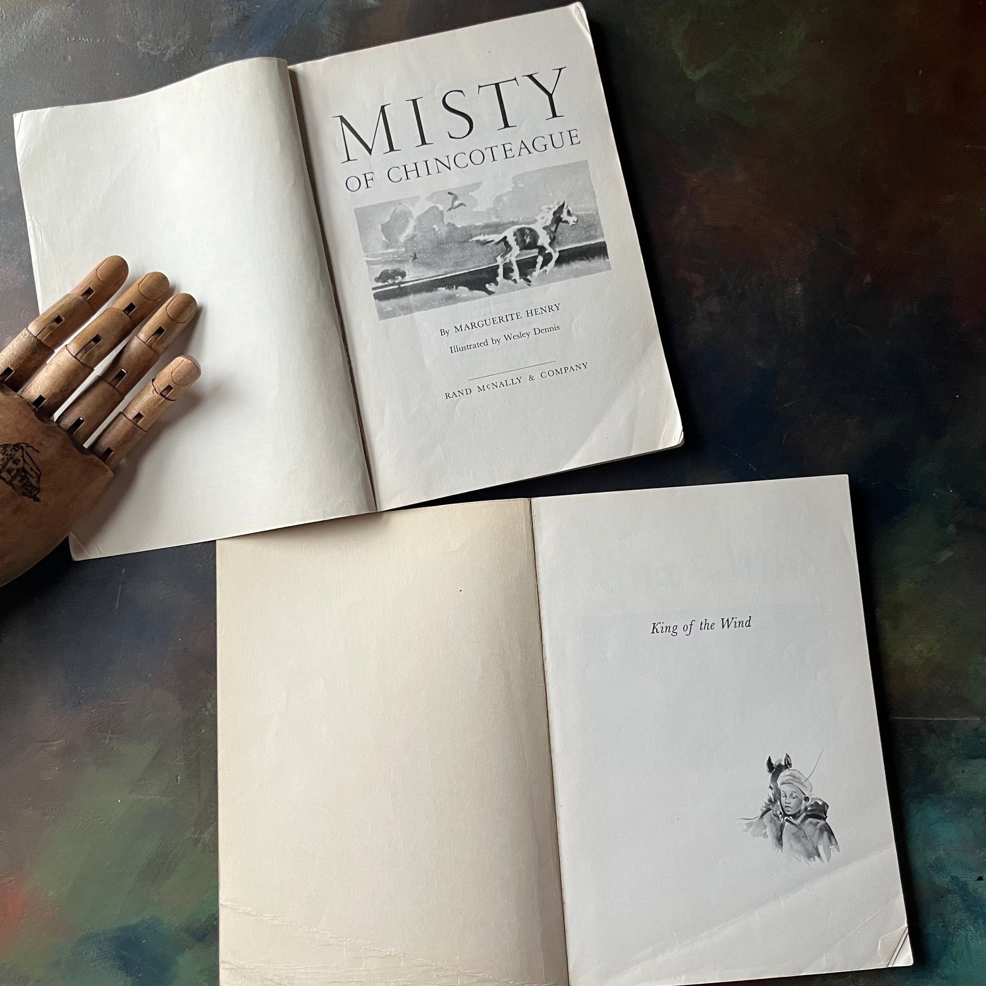 Pair of Margeurite Henry Horse Books-Misty of Chincoteague-King of the Wind-Newbery Award Book-vintage children's horse stories-view of the inside covers.
